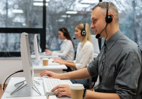 colleagues-working-together-call-center-office-with-coffee