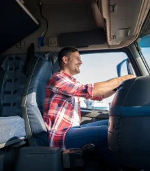 happy-professional-middle-aged-truck-driver-casual-clothes-driving-truck-highway